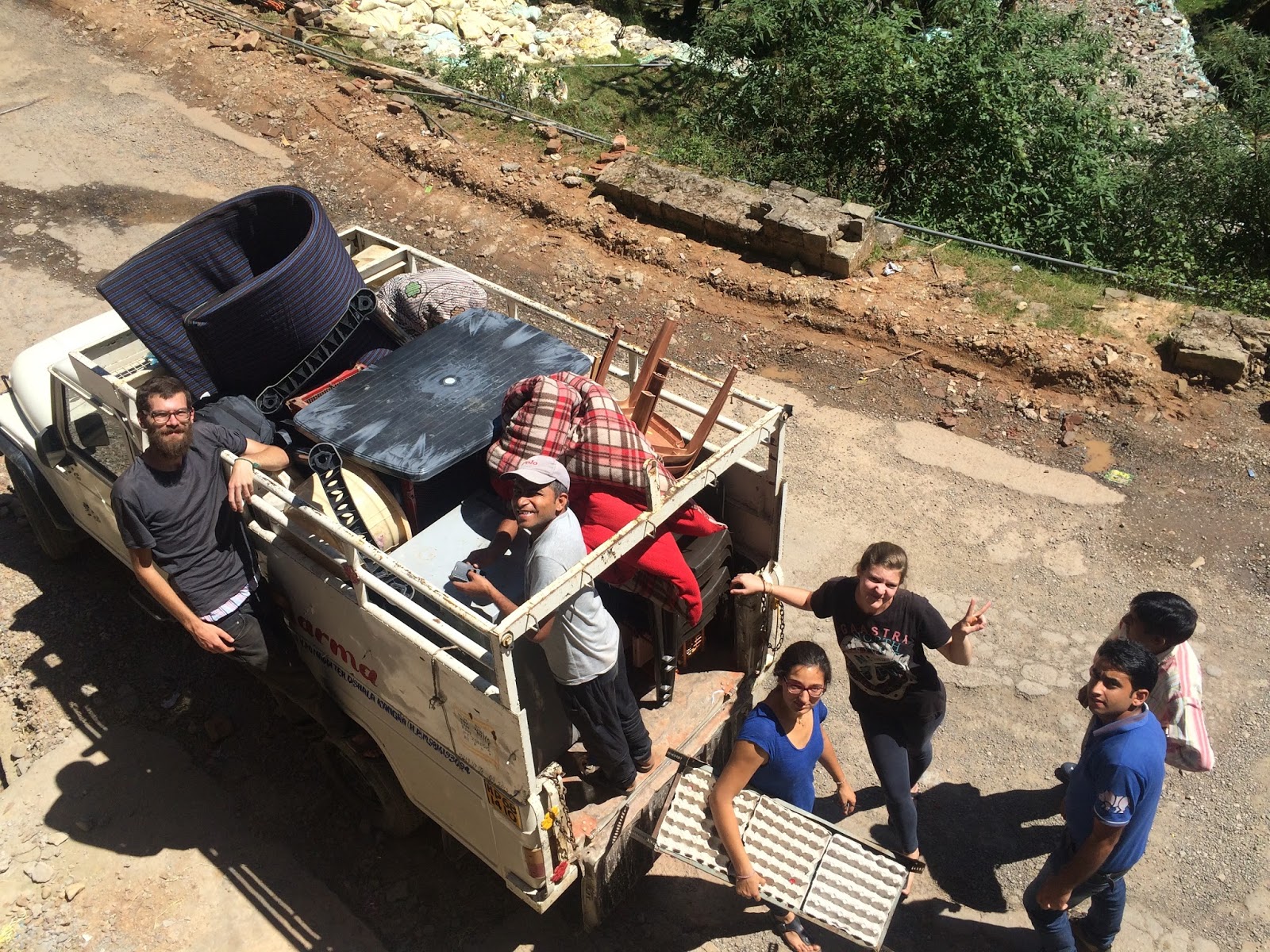 Volunteers loading furniture onto a truck.